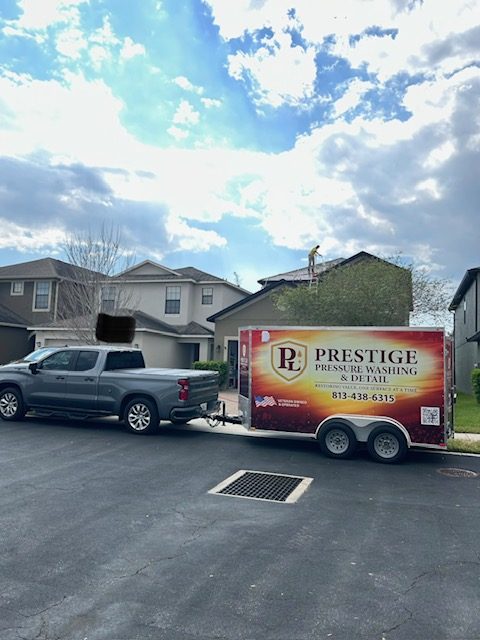 Prestige crew soft washing a home exterior in Brandon, FL