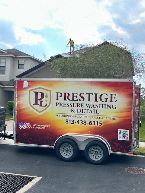 Prestige crew soft washing a roof in Brandon, FL