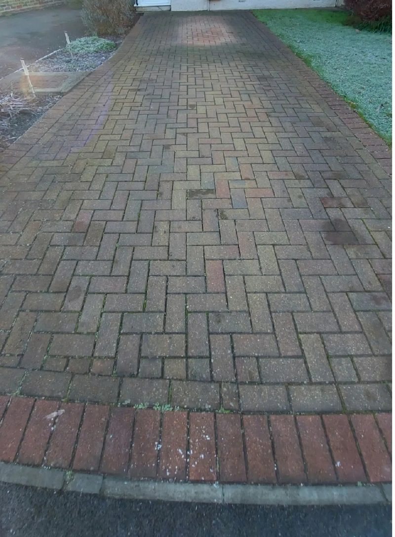 The same walkway before cleaning, black with mildew